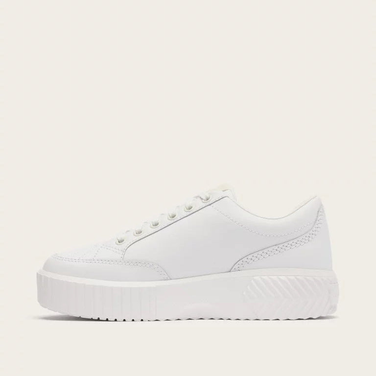 White sneaker on a light beige background