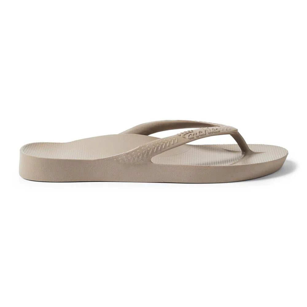 A single taupe-colored arch support flip flop with textured sole.