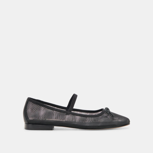 A black ballet flat with a round toe and flat heel, featuring a patterned upper and a bow detail on the front.