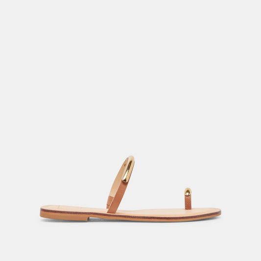 A pair of brown Wink sandals with a simple, slip-on design featuring gold-tone hardware.