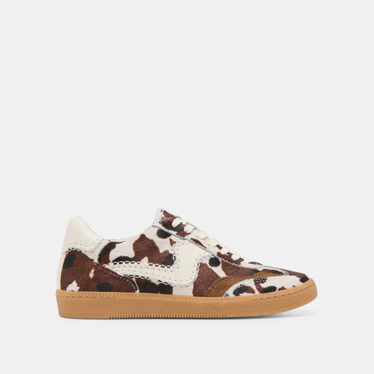Cow print sneaker with brown and white pattern on a light gray background