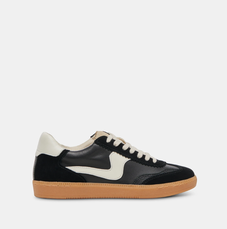 A black and white sneaker with a lace-up closure and a thick white sole.