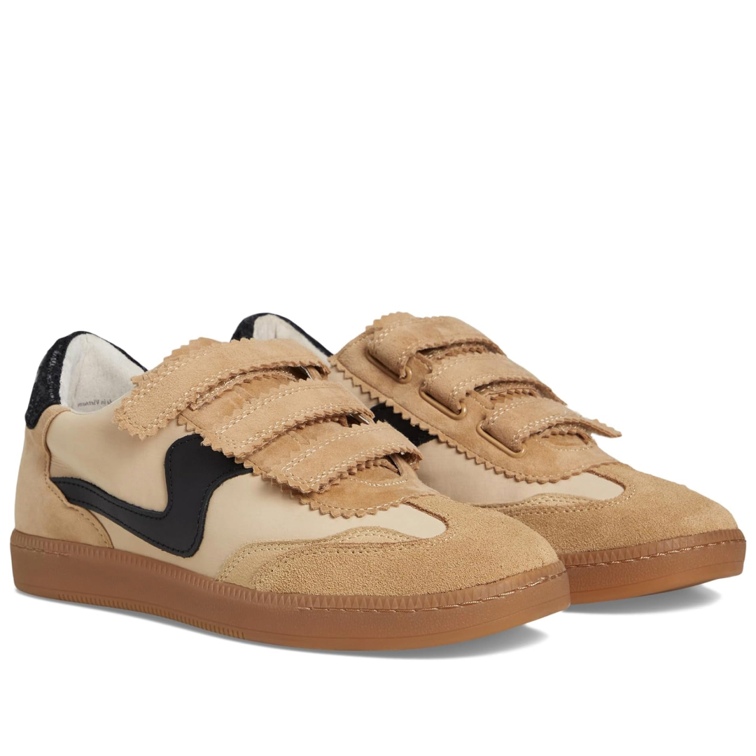 Pair of beige sneakers with black accents on a white background