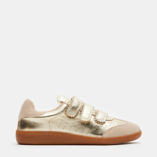 A gold low-top Velcro sneaker with a leather and suede upper material and a synthetic sole.