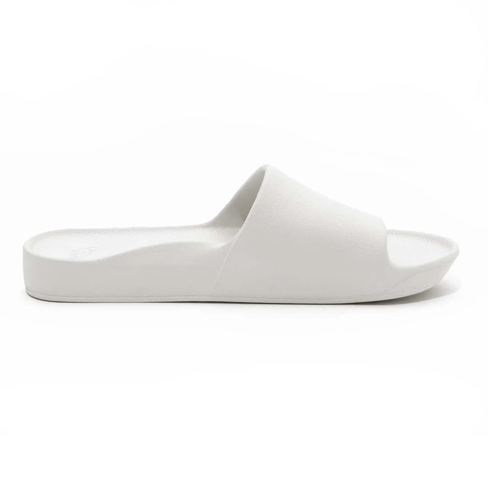 A single white arch support slide with a simple design, suitable for casual wear.