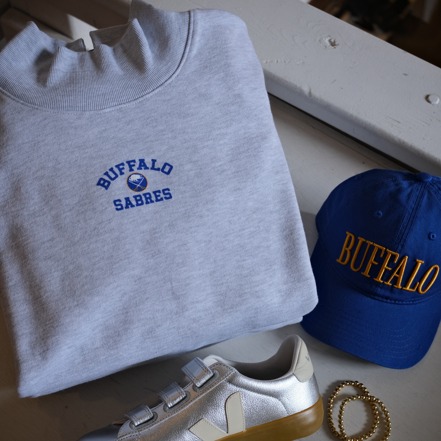 Sabres Spirited Arch Mock Neck